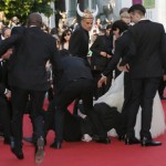 Man dives under star’s dress on Cannes red carpet